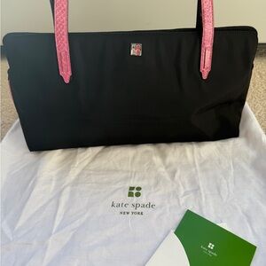 Vintage Kate Spade black shoulder handbag with pink trim.